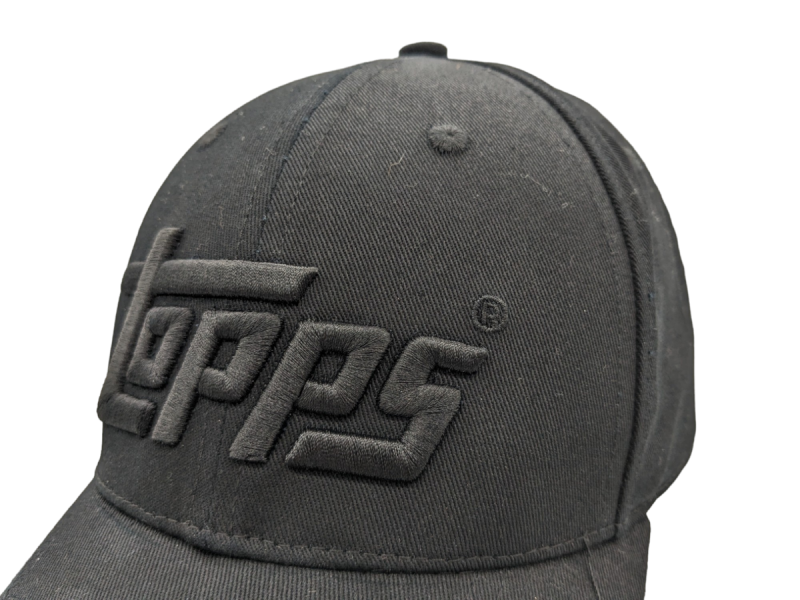 The Topps logo embroidered onto the front of a baseball hat in black thread.