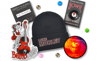 Custom beanies, pin badges, and patches to commemerate Gary Numan, Blaze Bayley, Luke Morley, and Bamboozle.