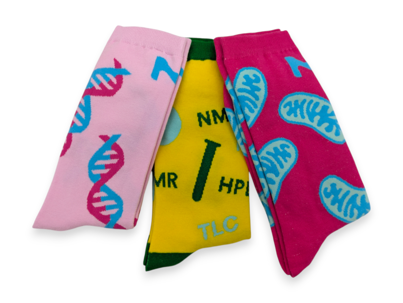 Three pairs of science-related custom socks featuring fun sciencey patterns.