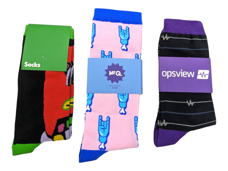 Three pairs of branded socks with branded cards that match the socks design.