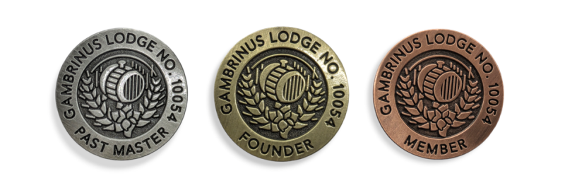 Three custom freemasons pin badges that signify membership, past masters, and founders.