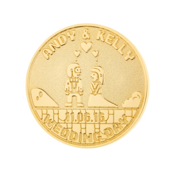 This gold challenge coin has a cartoon bride and groom and says