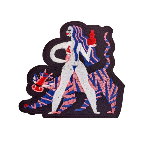 An embroidered patch depicts a semi-naked woman with blue and pink hair, and she's holding a red vase. A mutated tiger stands behind her; it has no face and pink and blue stripes.