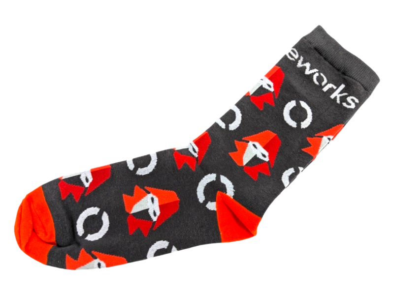 Dark grey and orange socks featuring a hooded character and eworks branding.