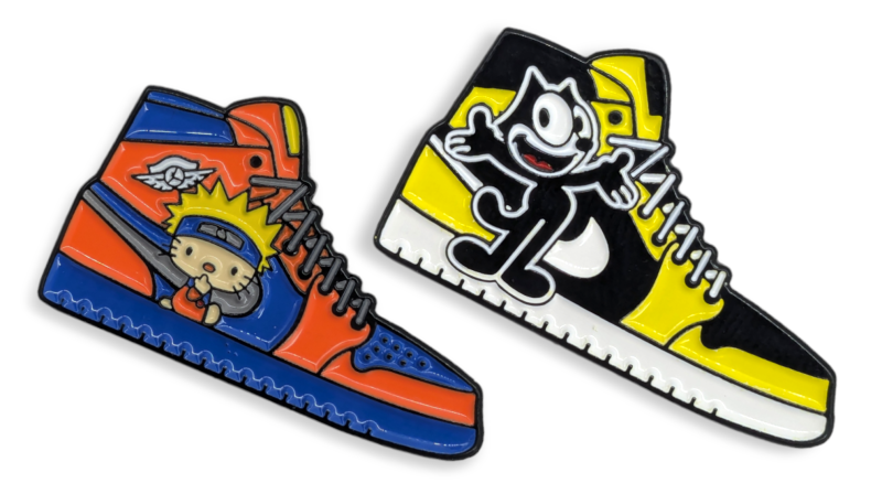 Two pin badges shape like Nike High-Tops with Naruto and Felix the cat on them.