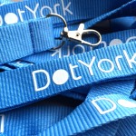 DotYork blue flat polyester lanyards with white print for web conference passes.