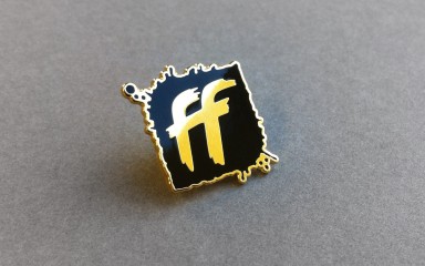 Gold plated, Hard enamel badge for Full Frontal conference in Brighton for Left Logic.