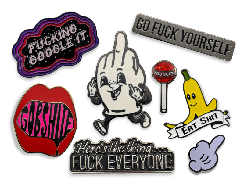 Offensive enamel pins with slogans like 'Gobshite' 'Fucking Google It' 'Eat Shit