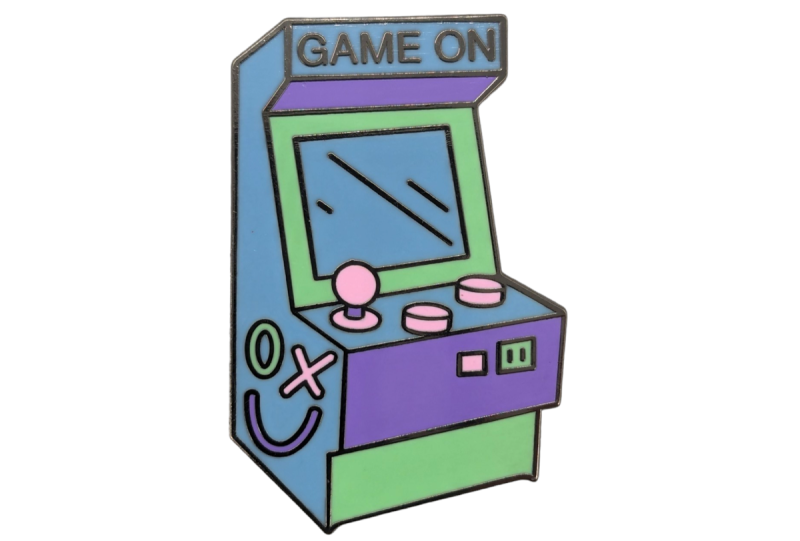 A video game cabinet pastel coloured enamel badge.