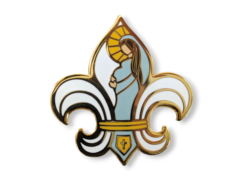 A hard enamel pin design in the shape of a Fleur-de-lis with the image of the virgin Mary inside.