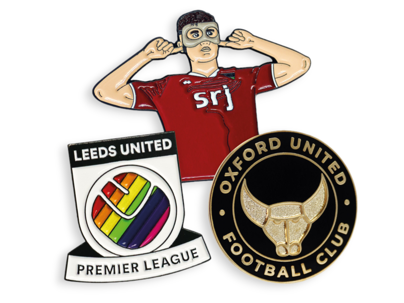 Three football related badges for Leeds United, Aberdeen, and Oxford United.