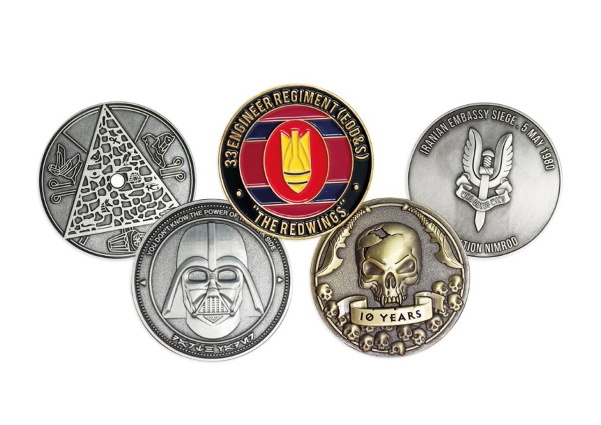 A selection of five custom coins made to commemorate military units, EDC groups and pop-culture genres.