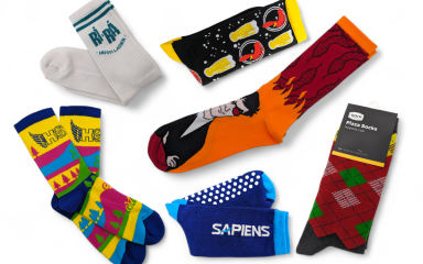 A collection of brightly coloured custom socks with a wide range of funky designs and branding.