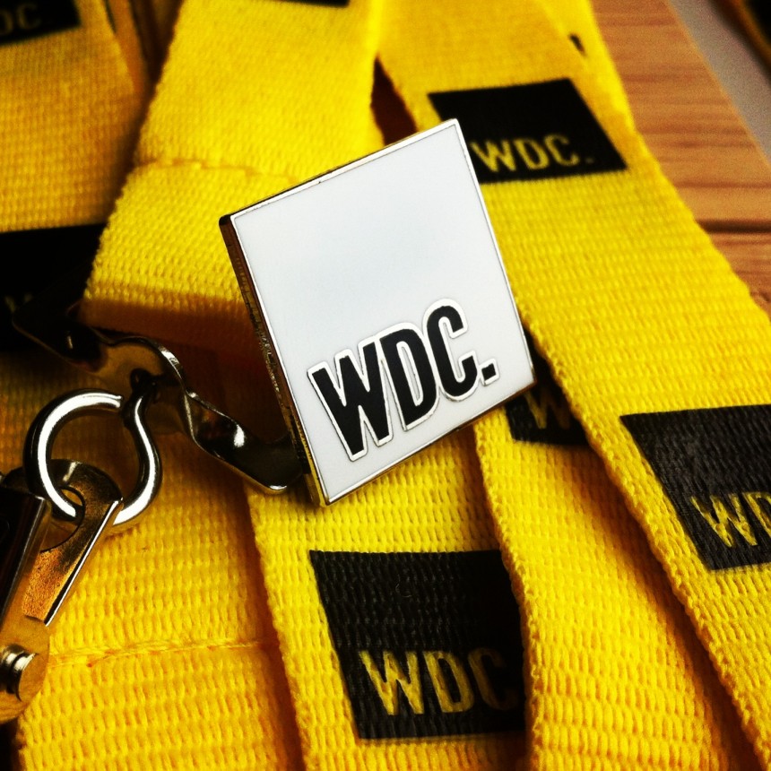 WDC hard enamel badge with yellow polyester lanyard and black silkscreen print logo.