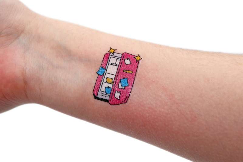 A cute fake tattoo on an arm.