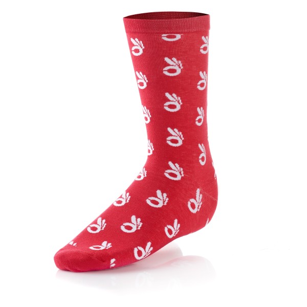 A pair of red custom knitted socks featuring a small icon design.