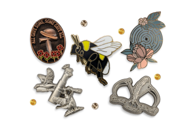 A collection of classic lapel pins and enamel badges to highlight the differences.