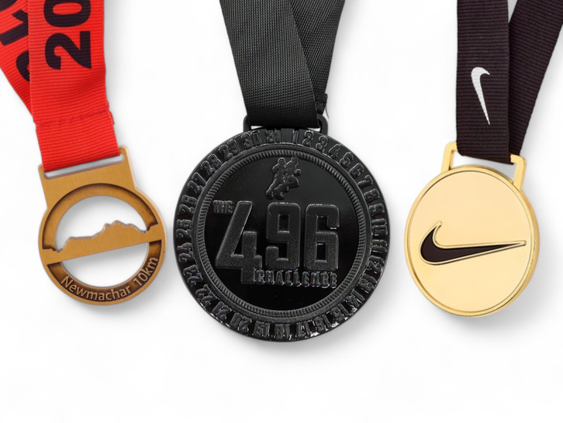 Three custom running medals that our clients created for their races.