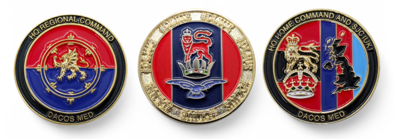 Three colourful challenge coins for army and navy units. They feature the units insignias and mottos.