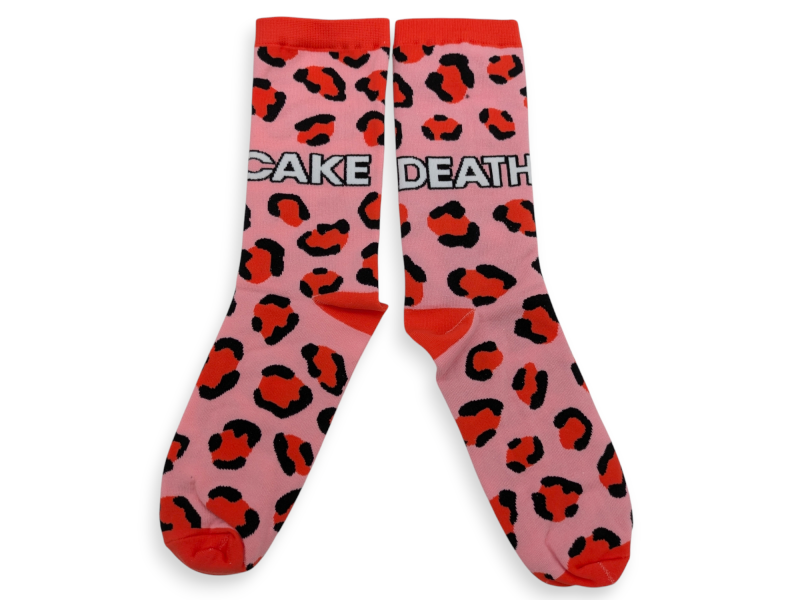 Some pink leopard print socks with the words 