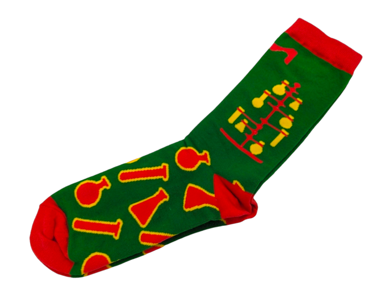 Green and red socks with science graphics in red and yellow.