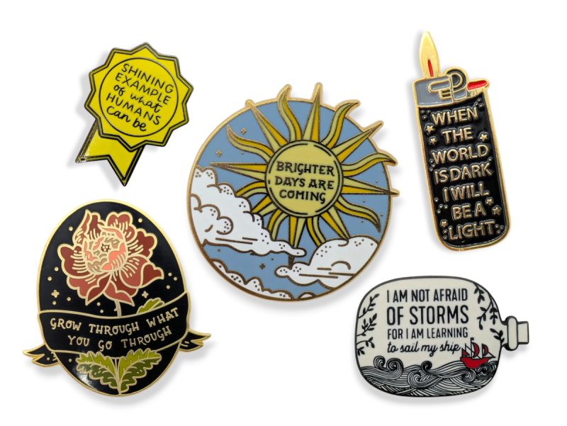 A collection of enamel pins with positive quotes on to stave off the perils of negative thoughts.