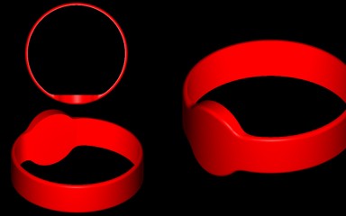 Three red silicone wristbands on a black background.