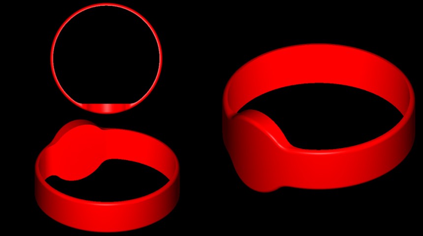 Three red silicone wristbands on a black background.