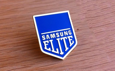 Blue enamel filled soft enamel badge with nickel plating that says 