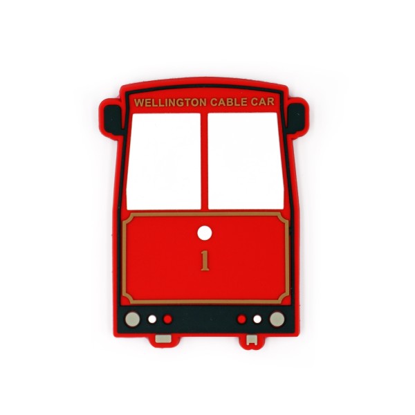 A PVC fridge magnet in the shape of a red London bus.