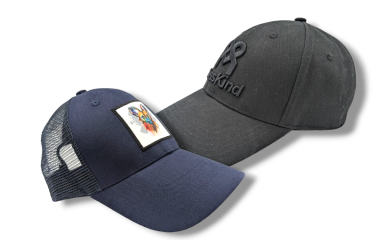 A black baseball cap and blue trucker hat side by side to compare the differences between the two.