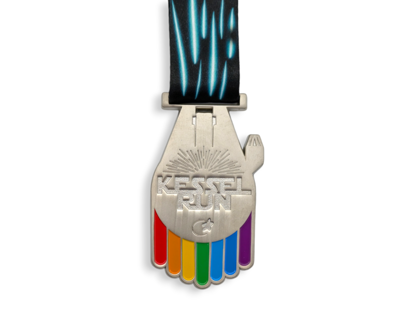 A race medal in the shape of the Millenium Falcon with the words 