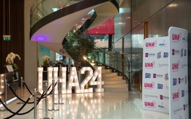 The foyer of a hotel in Manchester features a giant illuminated 