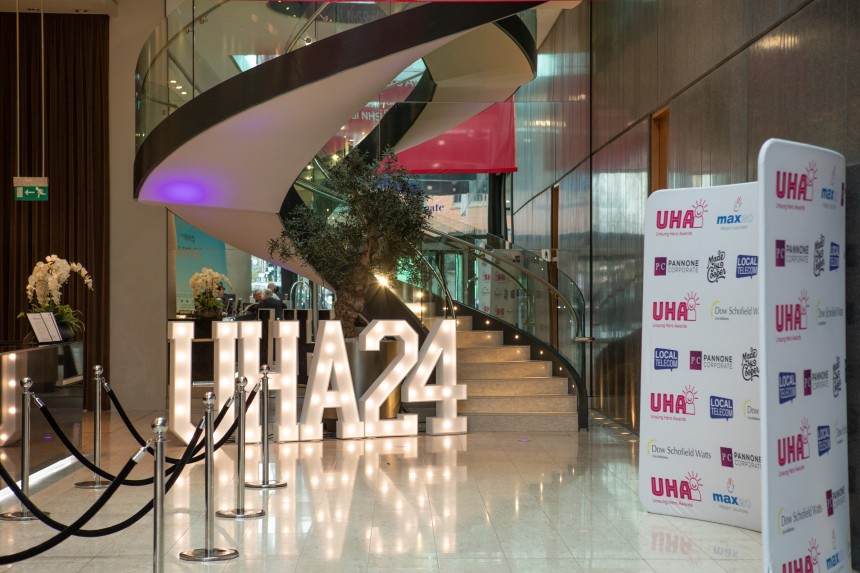 The foyer of a hotel in Manchester features a giant illuminated 