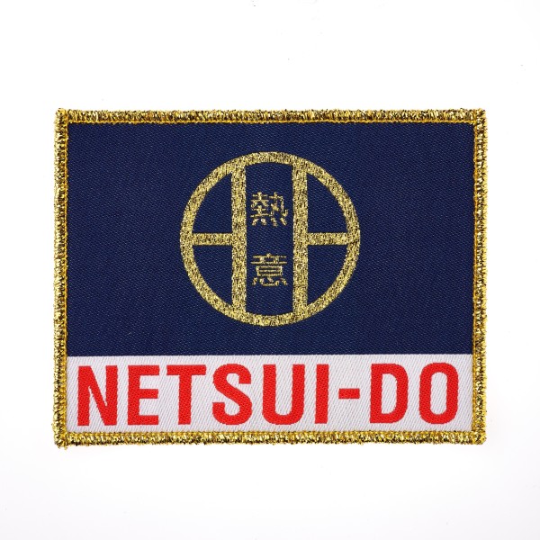 A rectangular patch with blue and white background and golden threads around the edge. The text reads